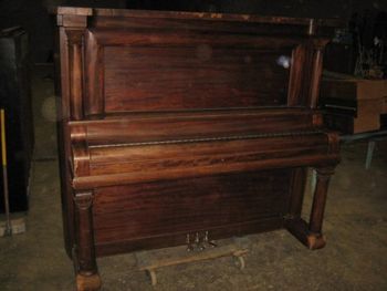 1913 Gram & Rightsteig a donation traded to us because the children wanted a keyboard instead. This was an unusual piano with massive columns and barrel shaped vertical sides. It also sounded awesome