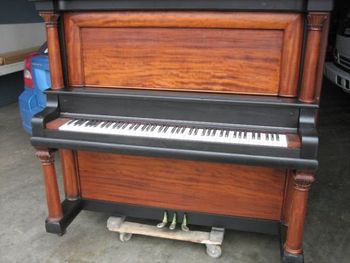 Same piano after refinishing, Signature satin black and natural wood with clear lacquer. We did eventually ask the new owner if he wanted us to remove the green masking tape from the pedals.