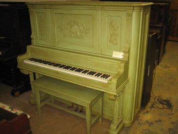 Someone professionally painted this piano which we think has burl Walnut veneer this green antiqued enamel color. Original Ivory keys in mint condition and super nice non tubby bass sound.This is before stripping. A couple more days and this piano would have went to the dump. A guy just happened to see our truck on his lunch break. Many of these pianos end up at the dump every day.