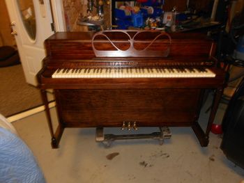 Betsy Ross Spinet Refinished in Mahogany, this could be described as a faux finish since the wood was a paint grade non stainable, we dyed the wood first then stained it. Several coats of satin clear, polished brass etc. huge difference
