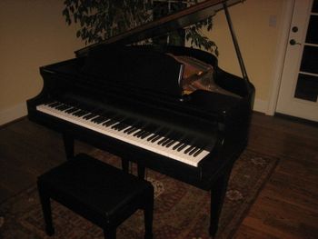 1930 Winter Baby Grand, New satin ebony finish, New key covers, sharps, polished brass, hardware, recovered seat. Pictured in its new home
