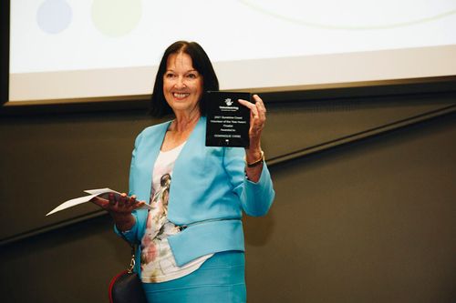 Volunteering Sunshine Coast June 2021 - Jenny Mackay accepting the award for Dominique Cisse of Festuri for the HUMAN RIGHTS & MIGRANT SERVICES