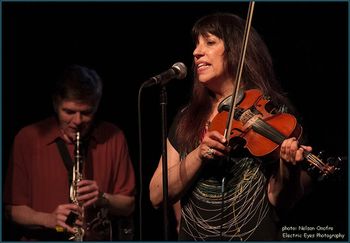 Matt Cowand on bari sax and Margey Peters on fiddle at the NYC Great Day In The Morning CD release concert. Photo by Nelson Onofre.