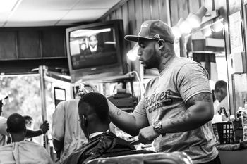 "I’ve been incarcerated twice. This barbering thing has helped me focus on the positive." Marcus Carter, 419 E Patapsco Avenue