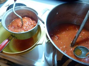 Canning tomatoes - processing tomatoes with hand food mill