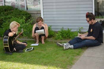 Lena MacDonald, Anna Jo, & Stephen Cooper write a song outside the Tambourine Collaboratory - photo by Charles Boheme