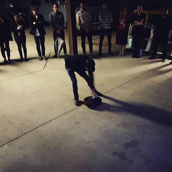 pat mAcdonald spins the bottle to commence the 2016 Construction Zone songwriting. - photo by melaniejane