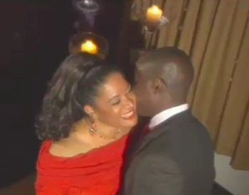 A still from Tracey Whitney's "I'm Gonna Love You Just A Little More Baby" video shoot. The actor with Tracey is Adewole Williams. The video was produced by Patricia Mueller and Tracey.