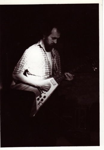 A pic from the 1980's. Probably performing with Easy Street, a band that was based out of Washington MO. Still have the "V," which is my primary slide electric guitar.