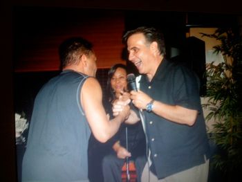 Feliciano Tavares from the TAVARES singing the Saturday Night Fever hit song "More Than A Women" at Charlie's birhday party at Prezzo's.