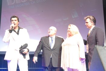 John Travolta aka Manny tells the audiance that "Disco Never Died" as Leo Vela, France Joli, and Charlie look on.