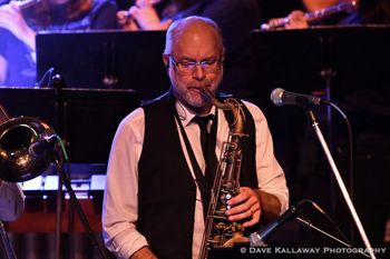 Mark Piasecki, alto sax, tenor sax, and flute. Mark is a free-lance saxophonist whose performances include commercial recordings, shows and private events. He has opened up for or performed with such artists as B.B. King, Johnny Mathis, Kenny Rogers, Frank Sinatra Jr., Al Martino, The Jimmy Dorsey Band, The Four Tops, The Four Aces and many more. Mark has appeared as a guest soloist and has conducted workshops and rehearsal clinics for school-age groups throughout the state.