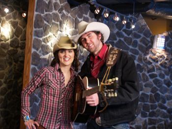 Tim with Silvie Hill from the T.V. show "The Letters" where Hus was a guest expert on writin' bulldozer drivin' love songs