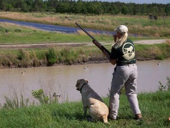 Angie blows her duck call to start the action in the second series of the Delta Waterfowl Mid Atlantic retriever Championship.