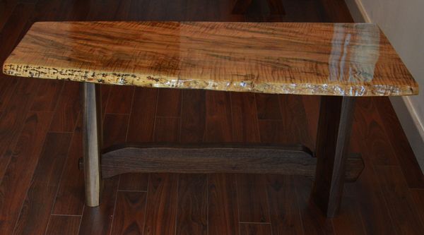 Spalted Maple top with a natural edge. Walnut base. 40" X 16" X 19"