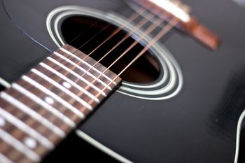 (06/10/14) This will be the last post for a little as I have posted all my guitars that I have right now. This was a great way to get a little better at photography. This last guitar was my first acoustic. It is a Washburn D10BK. It has a solid Spruce top and Mahogany back and Neck with a Rosewood fretboard. It was a great starter guitar and almost 18 years later it still plays nice.