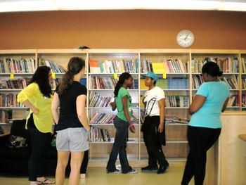 Cast member Starr works with a group during a Realize Your Beauty Workshop with Girls Inc. of New York City. June 2, 2012; Brooklyn, NY.