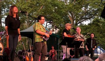 Adam Traum in Central Park with Jenny Muldaur, left, Happy Traum, John Sebastian and Richard Barone.