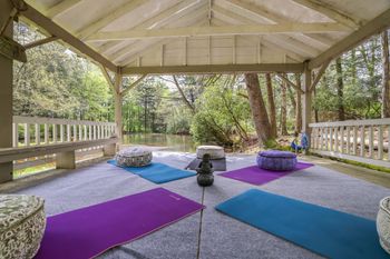 Yoga on the pond in the boat house
