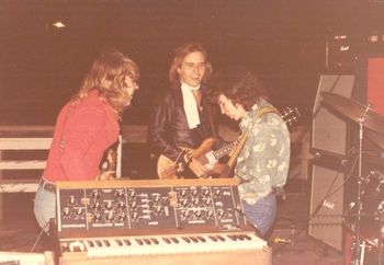 Age 19 - Madgic. From Left to Right: Jim Beilman, Don Weirman, and Fulton Calvery. Outside concert at Rock Haven in Hays, Kansas. Making our guitar faces.
