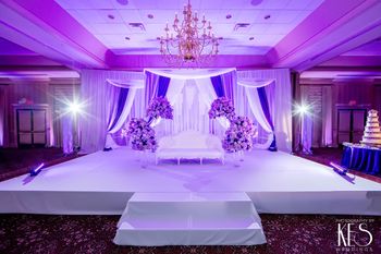 Stage Backdrop Draping with Lavender Lighting
