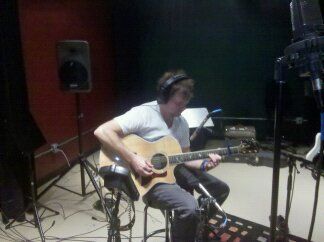 Russ laying down lead tracks on his Taylor acoustic guitar

