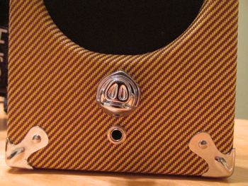 instrument cable plugs in under the volume
