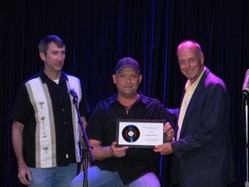 Robby Hopkins Receives Songwriter Award from Thom Cavin
