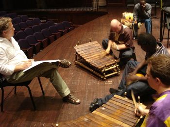 (l to r) Maestra David Delta Gier reviews the score, with Bernard and Mark.
