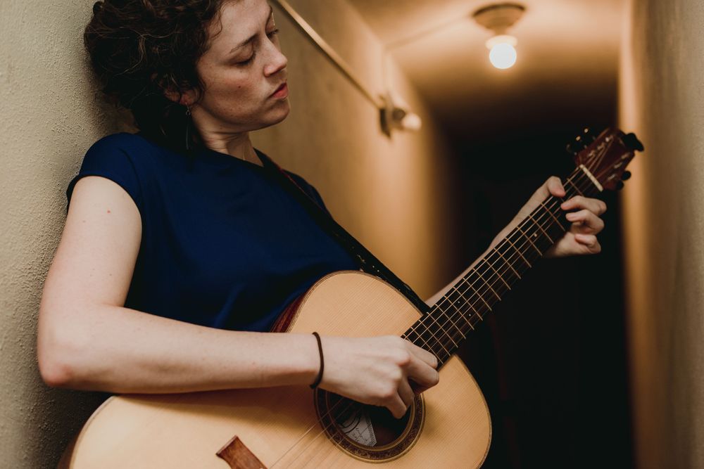 Indie-folk songwriter Rachael Kilgour with Guitar for Curve Magazine, by Kara Dupre