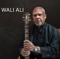 Paul plays with Wali Ali