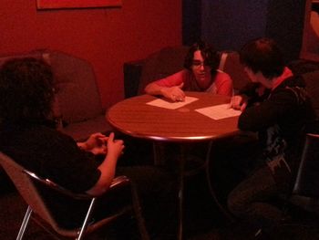Discussing late change to set list before going on.
