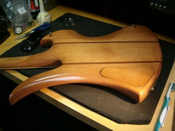 Original stain finish showing neck heel, maple control cavity cover
