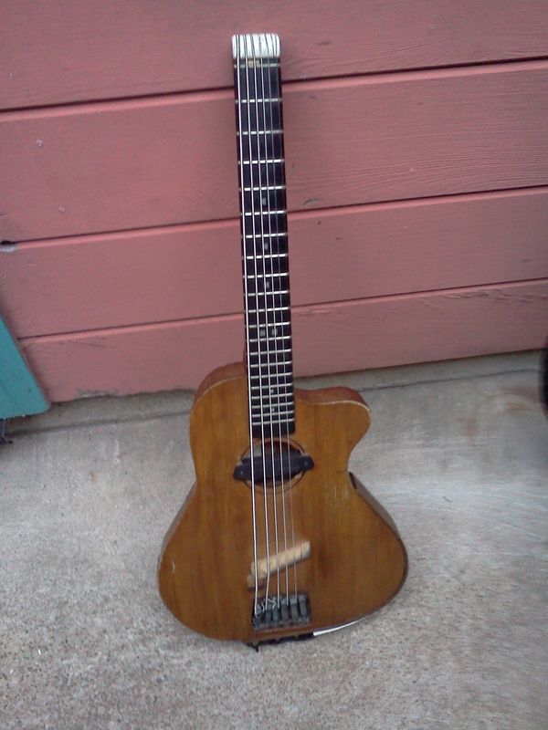 6/30/14 - #10 - Front view, as it is today, with a lot of road miles, a lot of patches, but still my go to traveling guitar. Teak has a low co-efficient of thermal expansion, so it does make a more temperature stable guitar. I am hoping # 14 or #16 (built a little more stout, expressly for that DAEBF#D tuning) to be a replacement. I'll have to wait and see...