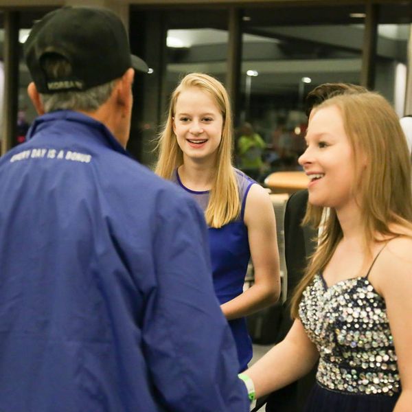 Vintage Mix greeting a Veteran at a Stars and Stripes Honor Flight.