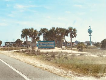 As soon as you're over the bridge, our sign and water tower greet you. You're home for the week. World off, music on.
