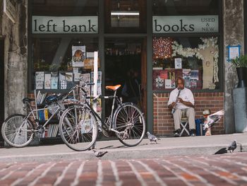 A clarinet player in front of the longest continuously running anarchist bookstore in America. Photo by John Westrock, Flickr.
