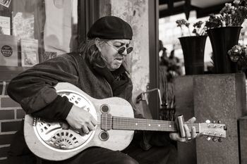 Reggie Miles plays slide guitar, undated. Photo by doug_r, Flickr.
