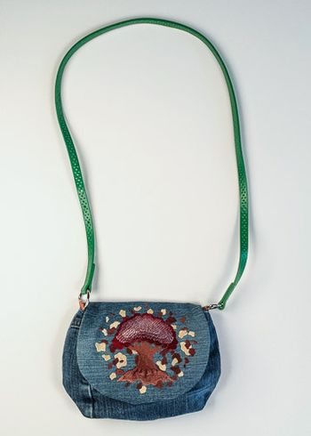 Five Elements - Earth embroidered on upcycled denim. The strap is a belt.
