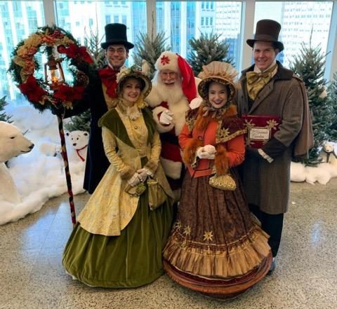 Christmas Carolers in Victorian Dress