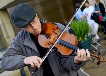 Jamie fiddling at the IU Art Museum
