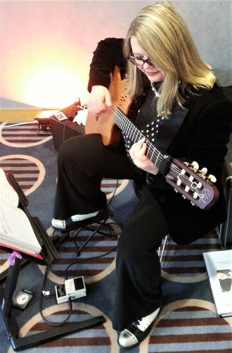 Guitarist performing at Radisson Jersey for a jazz party