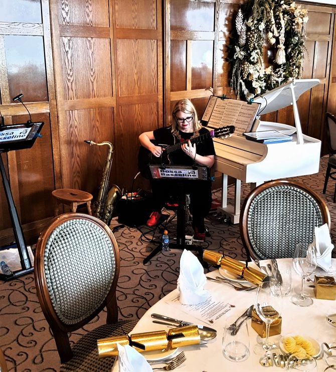 Guitarist performing at a Christmas dinner in Jersey