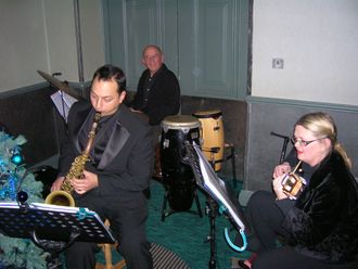 trio performing with special guest Alex Garnett at Corporate Christmas Booking