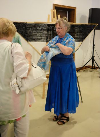 Jeanne Urbach with her loom in the background
