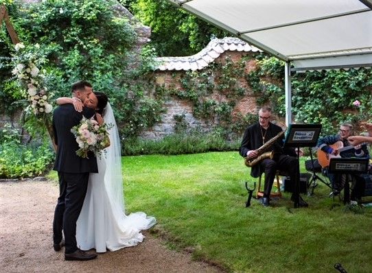 saxophone & guitar duo performing at a Jersey wedding ceremony