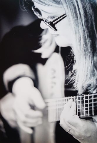 close-up of guitarist