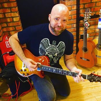 Playing "The Captain" Lee Anderton's Prized PRS 594SC at Anderton's Music in Guildford, UK April 10, 2017. Photo courtesy of Ronnie Ventura.
