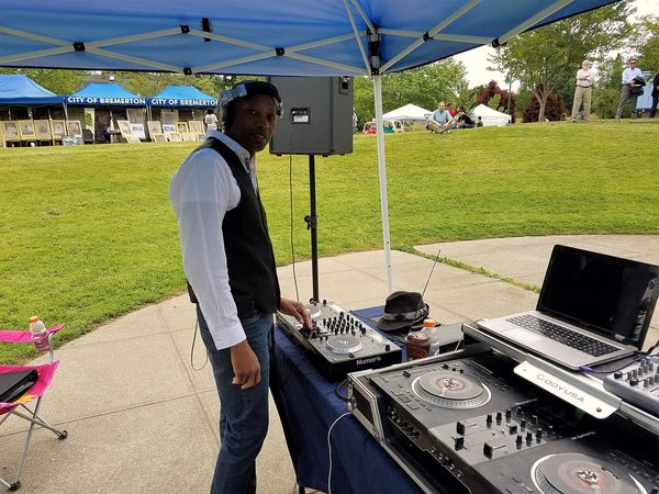 DJ Trouble Enuff providing services for (Juneteenth event). The location was Evergreen Park, Bremerton, WA