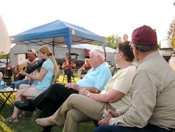 In June Julane played at a gathering in Rolette, North Dakota, and new and old friends came to listen. Here she plays an electric, black violin.
